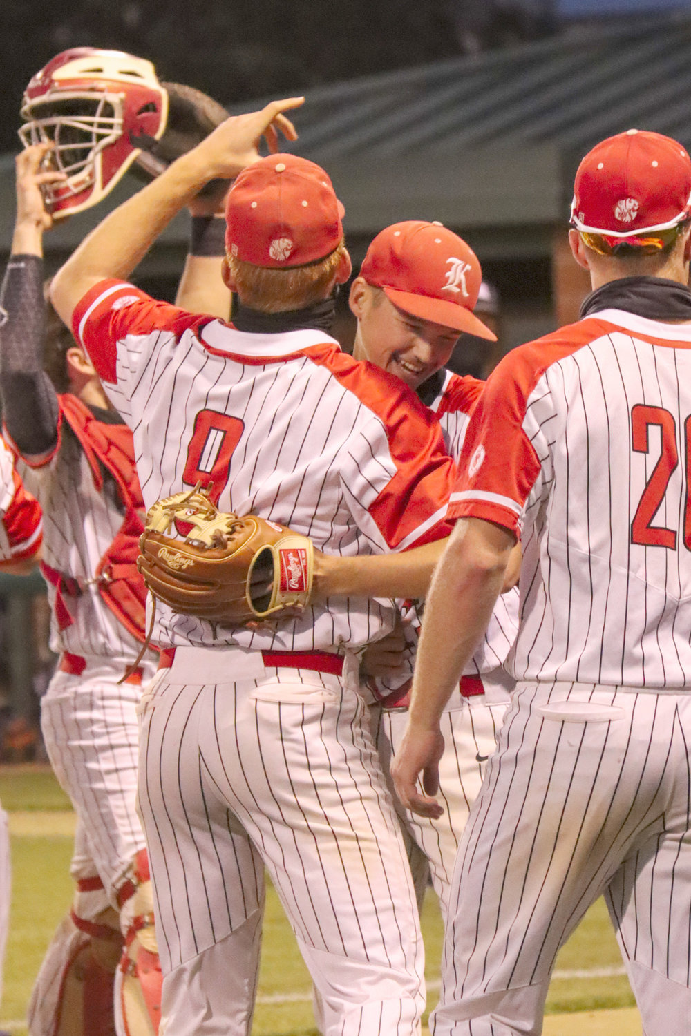 Katy High baseball players celebrate after their 11-2 win over Seven Lakes on Tuesday, April 20, at Katy High that secured the District 19-6A title outright for the Tigers.